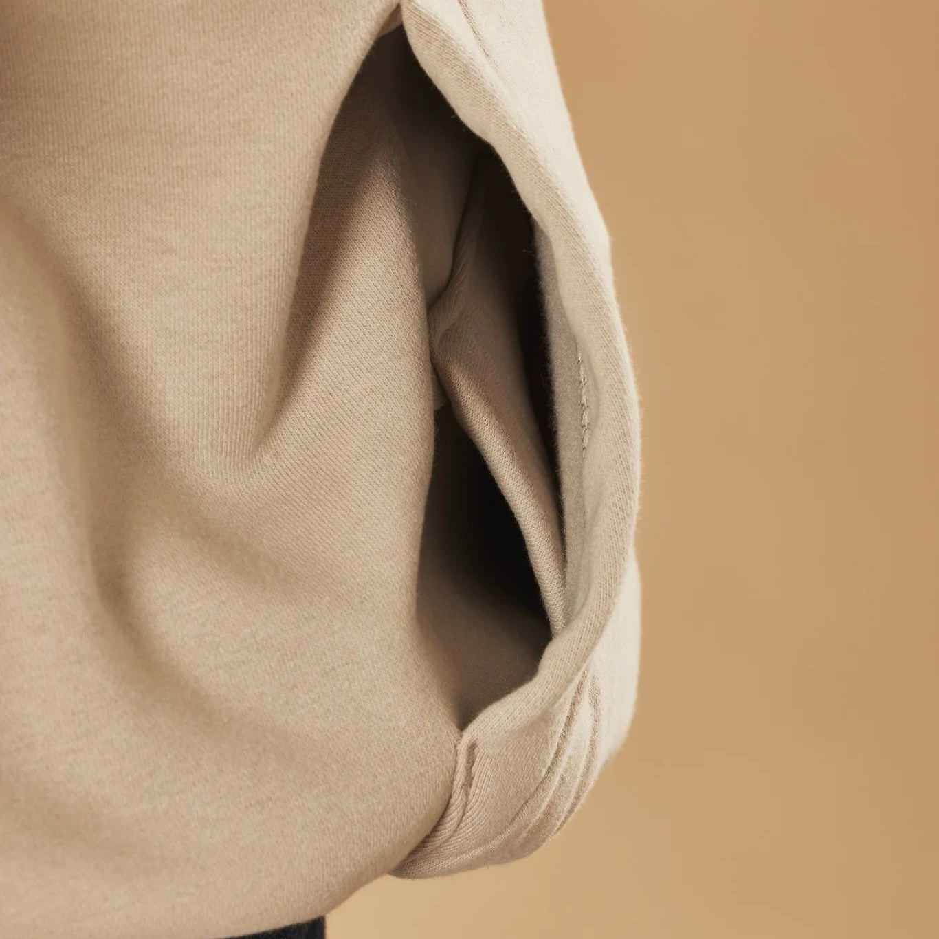 Close-up of natural stone hoodie pocket with a blurred background